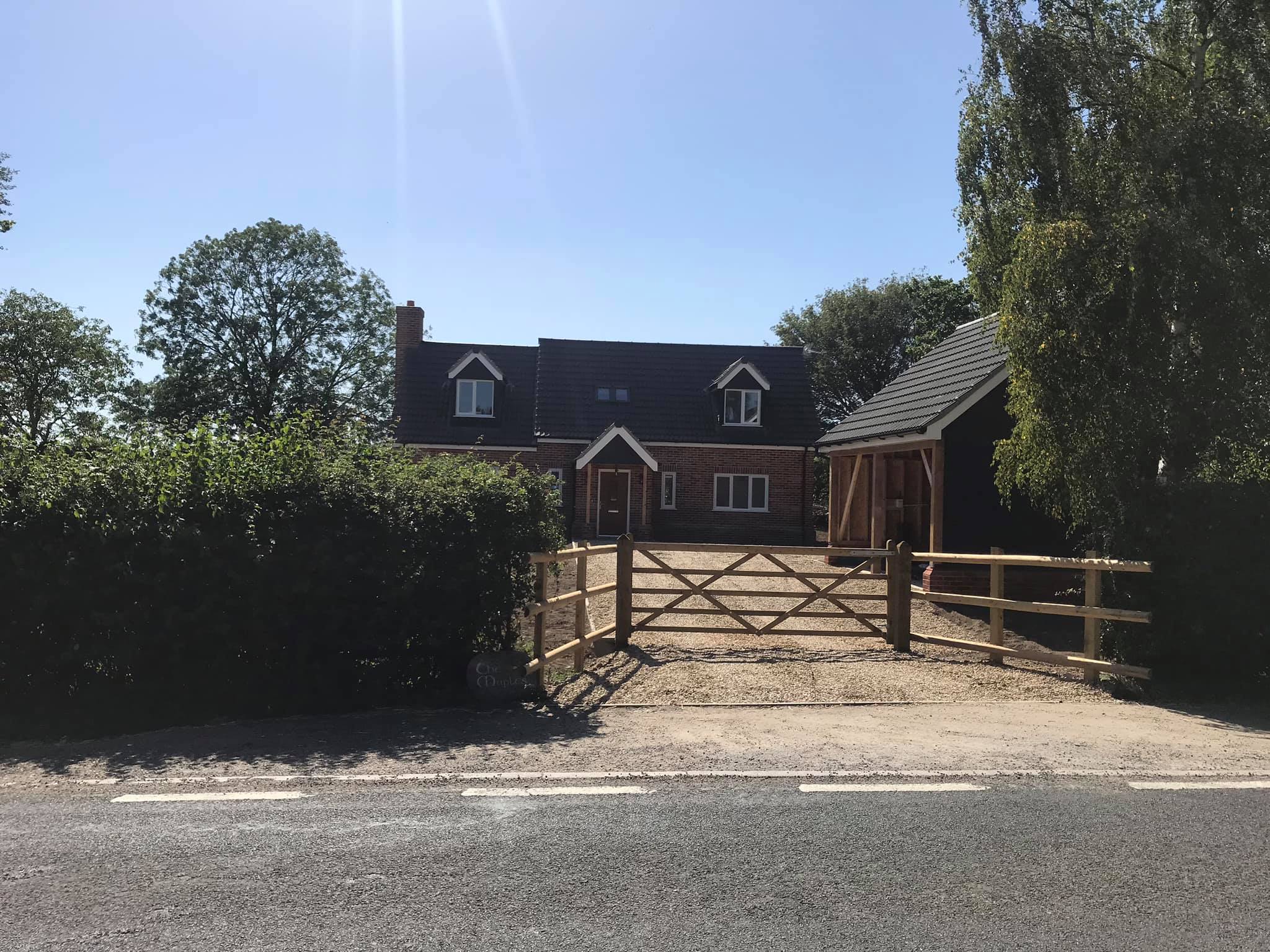 Front view and gate of new build house in Beccles by Gilbert Builders
